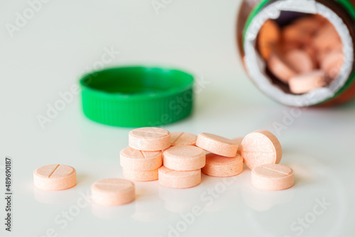 Vitamin c chewable tablets on white photo