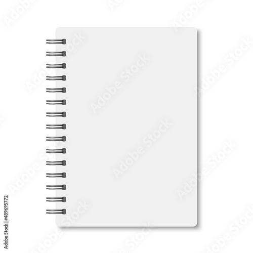 White realistic a6 notebook opened with shadows photo