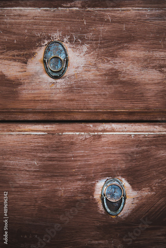 Two rings are placed on an vintage wooden texture