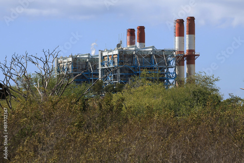 Aguirre Power Station from the nearby Jobos Bay National Estuarine Research and Wildlife Reserve in Aguirre, Puerto Rico, United States.	 photo