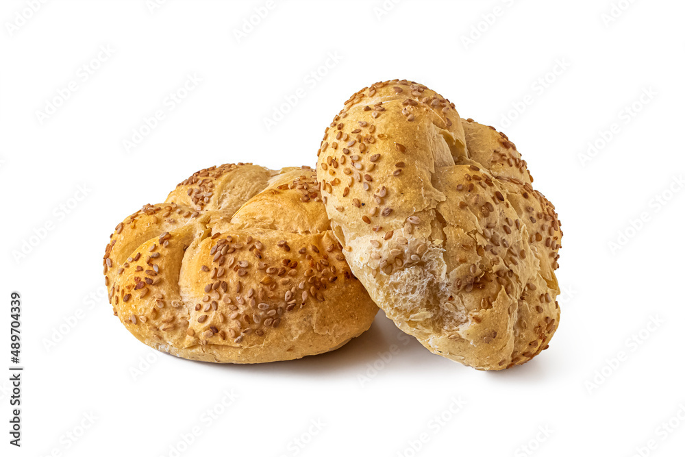 Kaiser buns sprinkled with sesame seeds, on white