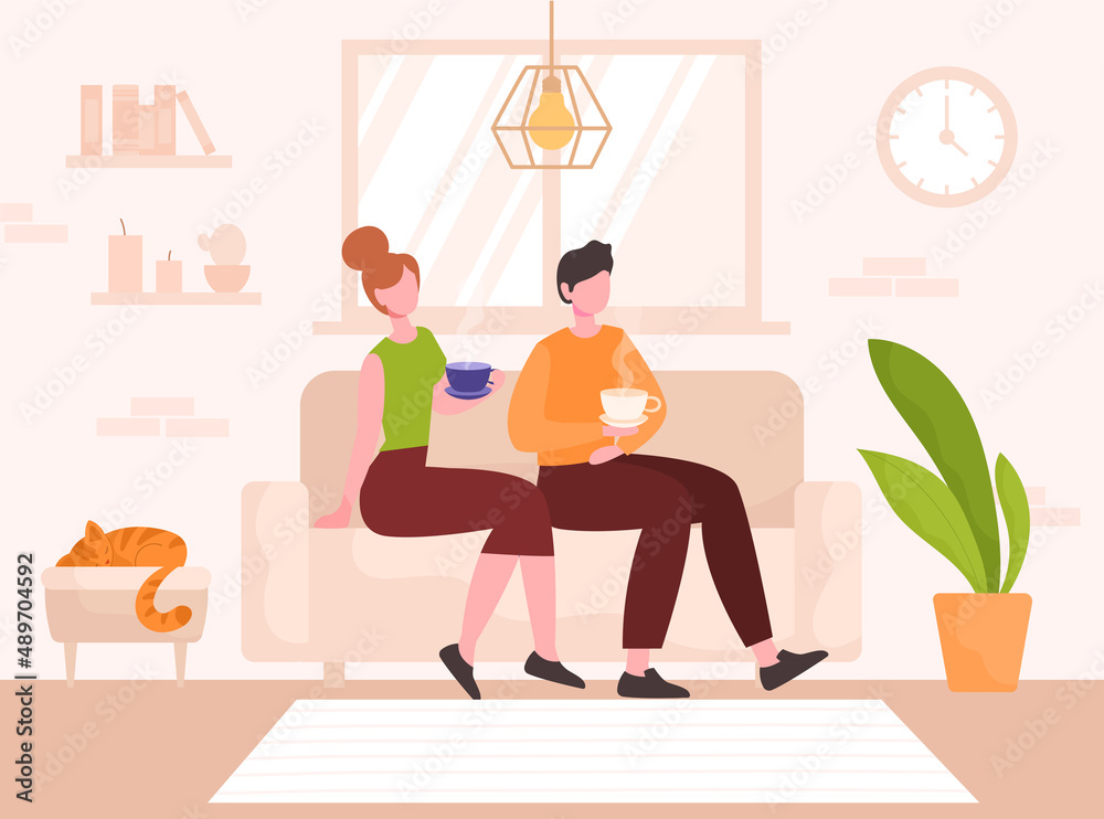 Fototapeta premium Young couple in love sitting on couch