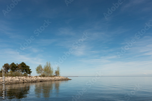 view of the lake with jetty and trees © eugen