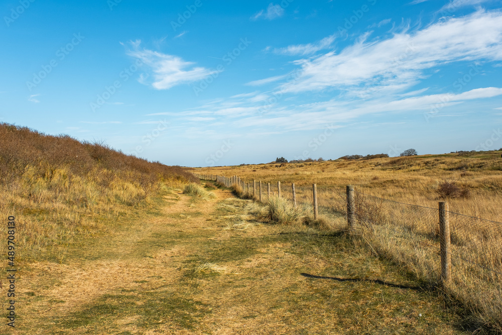 Rural footpath in Hunstanton, North Norfolk. Captured on a bright and sunny day in the winter.