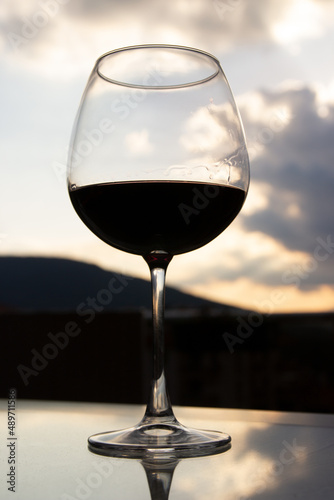 sunset and full wine glass