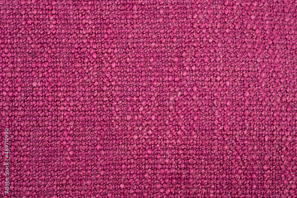 Close up on texture of pink purple soft woven fabric to show the detail and pattern of material. Background and texture concept. Close up on texture of pink purple soft woven fabric to show the detail and pattern of material. Background and texture concept.