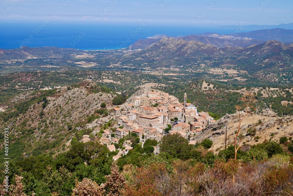 Panoramic view of Speloncato, a picturesque hillside village in Balagne, seen from Bocca di a Battaglia pass. Corsica, France.