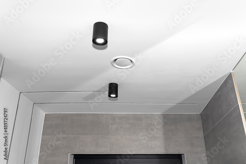 Domestic mechanical ventilation with heat recovery, a visible exhaust anemostat on the ceiling in the room. photo