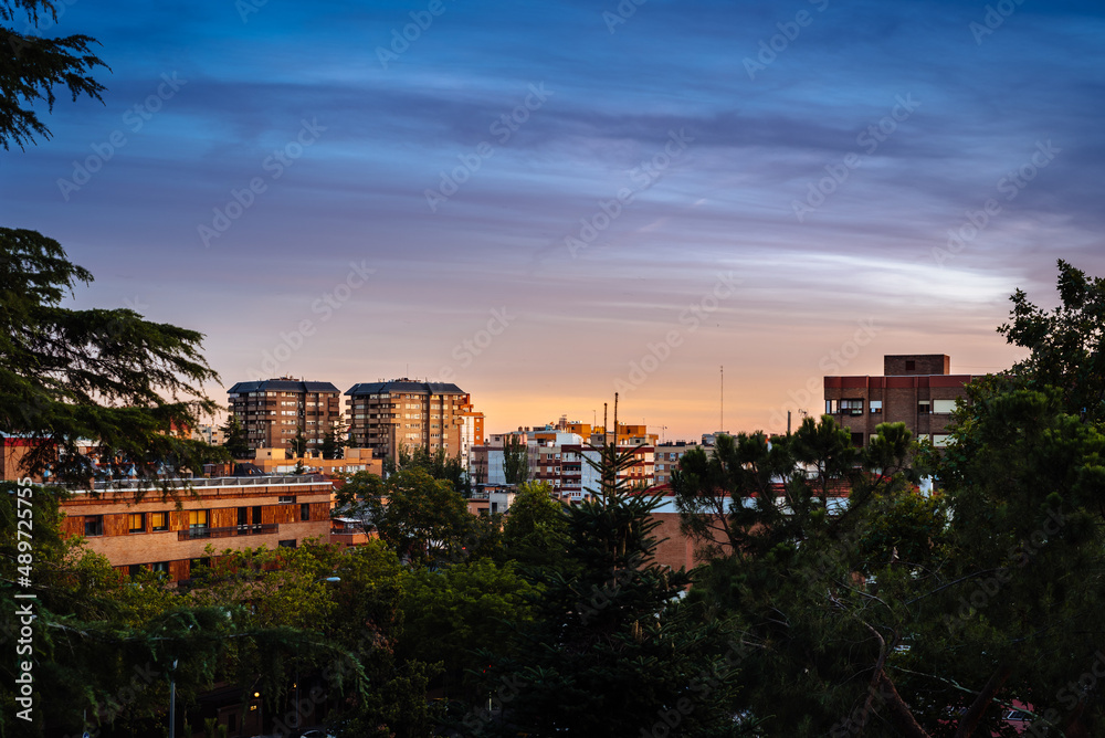 Sunset view of luxury upscale residential neighborhood in Madrid. Spanish real estate with apartments buildings. Arturo Soria Area.