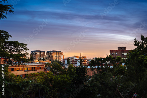 Sunset view of luxury upscale residential neighborhood in Madrid. Spanish real estate with apartments buildings. Arturo Soria Area. photo