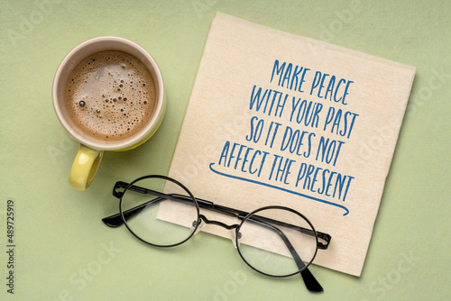 Make peace with your past so it does not affect the present - inspirational advice, handwriting on a napkin, personal development concept photo