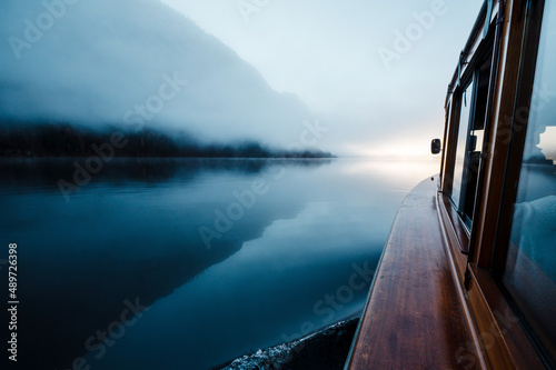 Close up of modern wooden boat floating on lake Konigsee