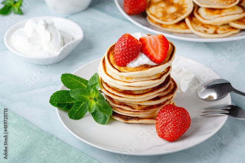 Stack of pancakes with fresh strawberry