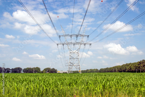 150KV high voltage pylons through a field at Hattemerbroek photo