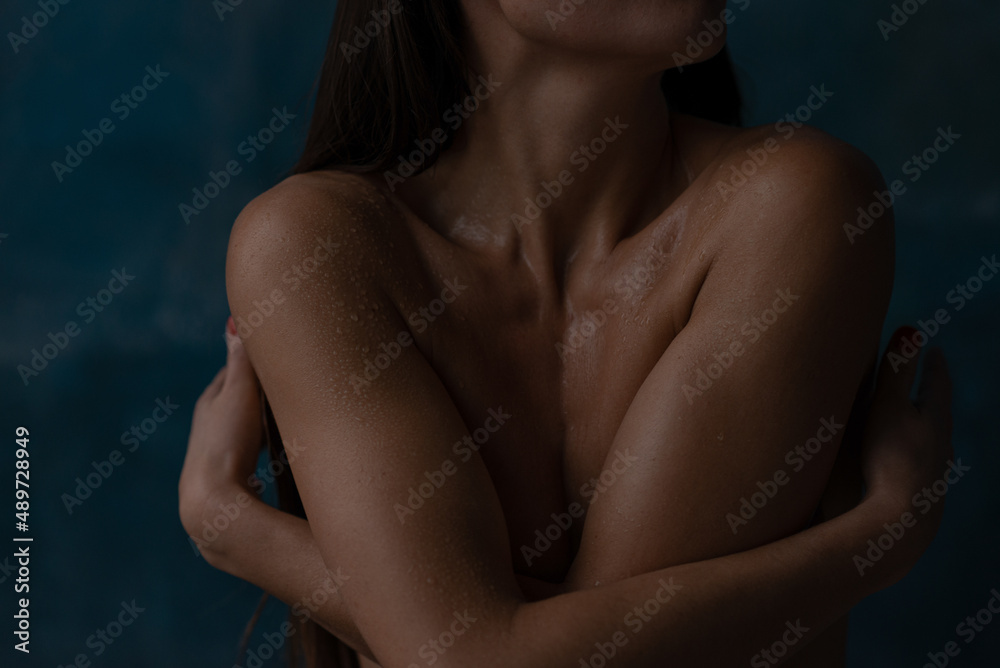 Beautiful burn woman embracing herself with naked body Beautiful burn woman embracing herself with naked body