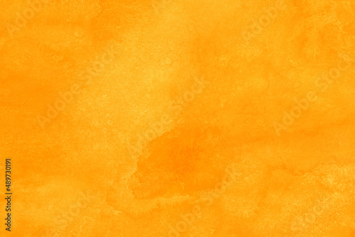 オレンジ色の無地水彩背景