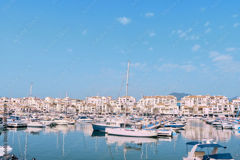 Puerto Banus, Marbella 25 de febrero de 2022, View of Puerto Banus marina with boats and white houses in Marbella town at sunrise, Andalusia, Spain