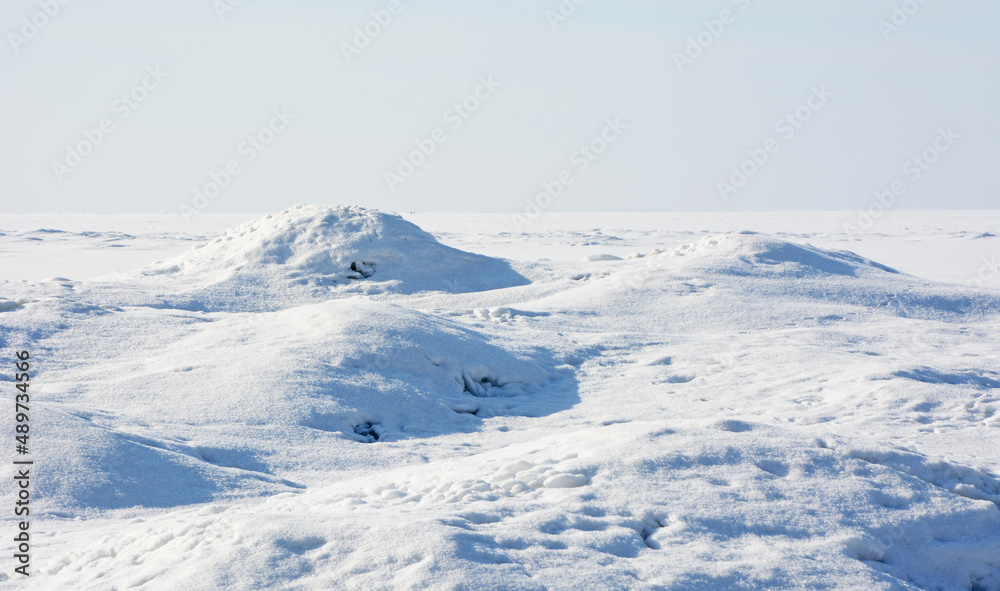 Ice hummocks on the coast of the Gulf of Finland in the spring (winter) season. Zelenogorsk, St. Petersburg, Russia. Ice hummocks on the coast of the Gulf of Finland in the spring (winter) season. Zelenogorsk, St. Petersburg, Russia.