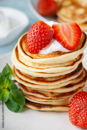 Stack of pancakes with fresh strawberry