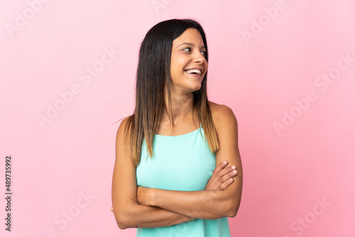 Caucasian girl isolated on pink background happy and smiling