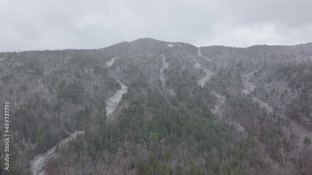 River cutting through snowy mountainous region aerial River cutting through snowy mountainous region aerial