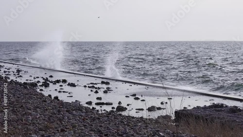 storm at sea. Waves hitting the breakwater