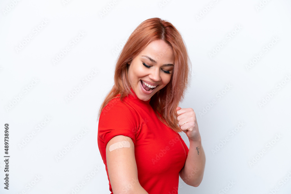 Young Russian girl wearing band-aids isolated on pink background celebrating a victory