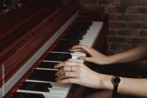 Young woman playing piano
