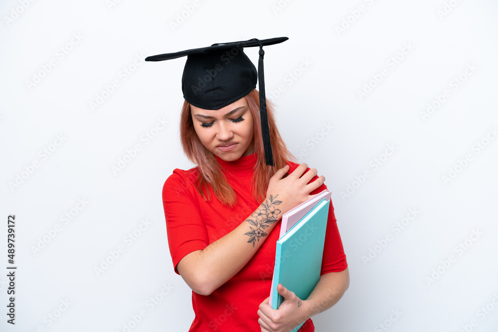 Young student Russian girl isolated on white background suffering from pain in shoulder for having made an effort