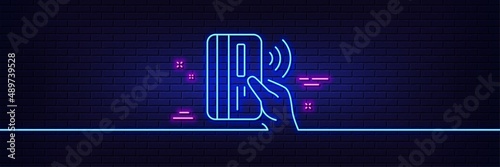 Neon light glow effect. Contactless payment card line icon. Money sign. 3d line neon glow icon. Brick wall banner. Contactless payment outline. Vector