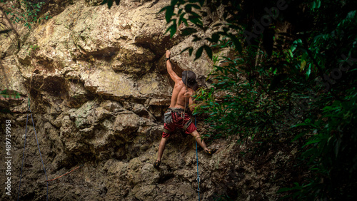 Powerful sportive rock climber