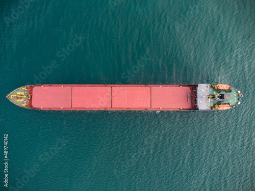 Canvas-taulu Large general cargo ship, Top down aerial view.