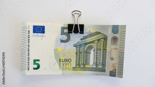 stack of 5 five euro banknotes with letter foldback clip - isolated  photo