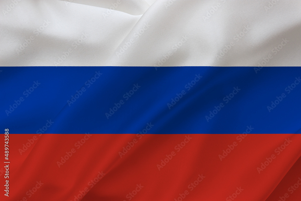 Russian flag on waving silk background. Russia national flag.
