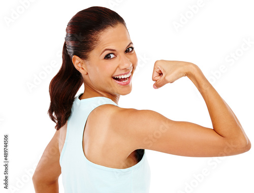 I cant believe what exercise has done for me. A gorgeous young woman glancing over her shoulder and pulling her bicep.