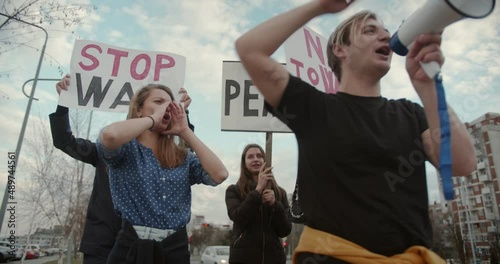 Stop the war, end the war protests with signs to act photo