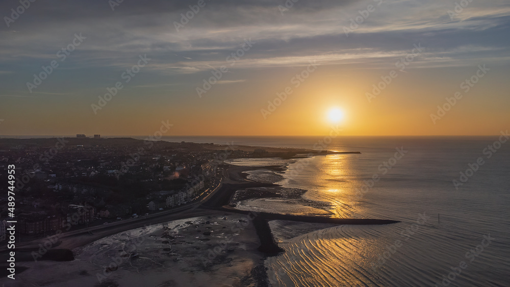 An aerial view of the sun setting over Morecambe in Lancashire, UK