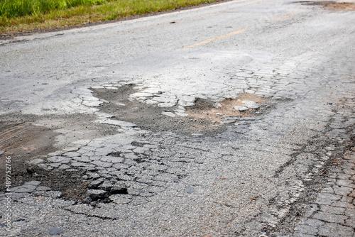 highway with damaged asphalt unsuitable for driving