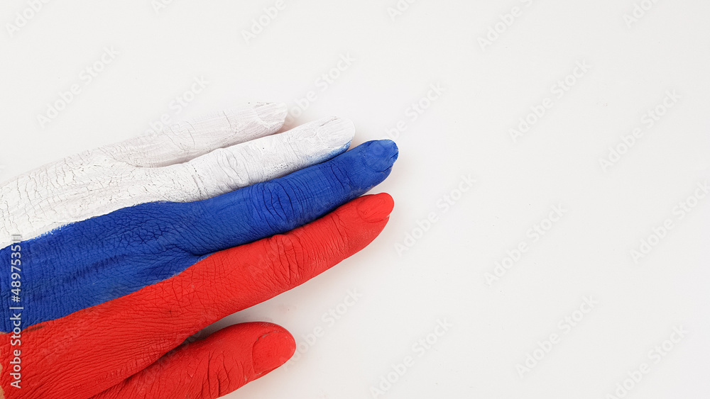 the hand is painted in the color of the Russian flag on a white background. place for text the hand is painted in the color of the Russian flag on a white background. place for text