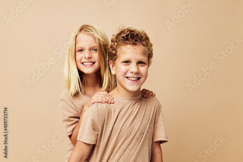 Photo of two children gesticulate with their hands together Lifestyle unaltered