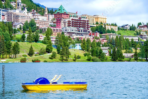 Tretboot auf dem Moritzersee mit Sankt Moritz im Hintergrund, Graubünden, Schweiz photo