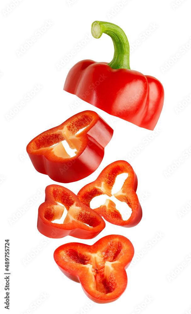 Flying slices of Bulgarian red pepper isolated on white background. Flying slices of Bulgarian red pepper isolated on white background.