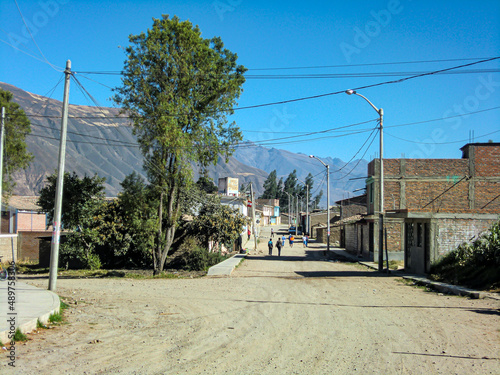 A deserted street with a dirt road.