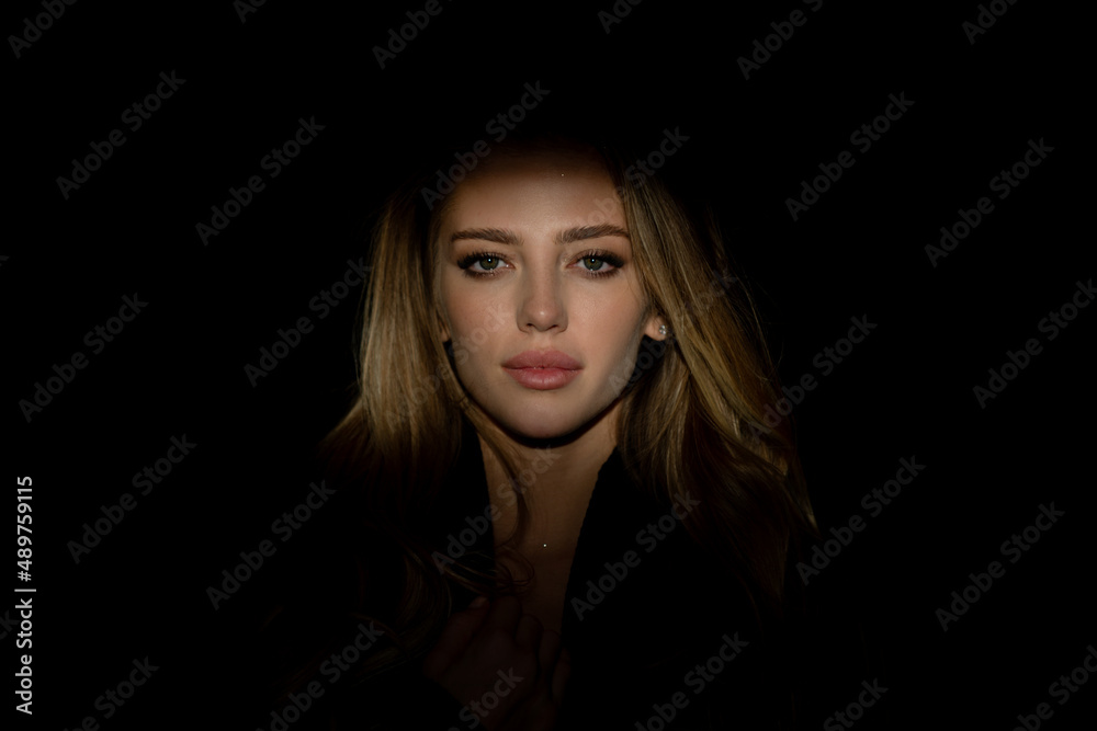 Portrait of young attractive woman. Dramatic and sensual portrait of a beautiful girl isolated on a dark background in studio. Beauty close up face of beautiful pretty girl on black. Portrait of young attractive woman. Dramatic and sensual portrait of a beautiful girl isolated on a dark background in studio. Beauty close up face of beautiful pretty girl on black.
