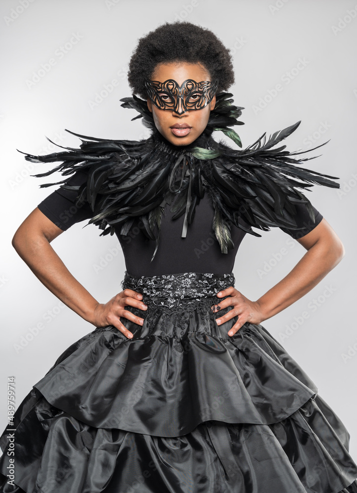 Black Woman in Feathered Black Dress with Fashionable Neckline Black Woman in Feathered Black Dress with Fashionable Neckline