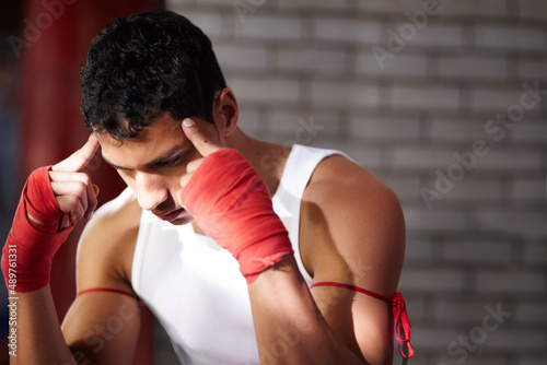You need to visualise yourself winning. A young fighter mentally preparing before a fight.