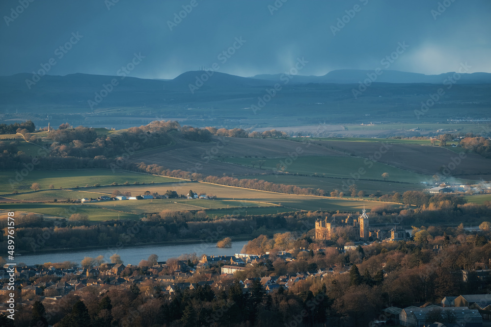 Top view of a Scottish town with an old castle on the lake at sunset. Linlithgow, Scotland