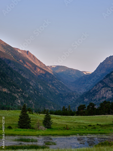 Sunset in the mountains with Sheep lake in the foreground in Rocky Mountains National Park