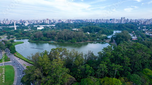 Aerial view of Ibirapuera Park in São Paulo, Brazil. Park with preserved green area. Residential and commercial buildings in the background