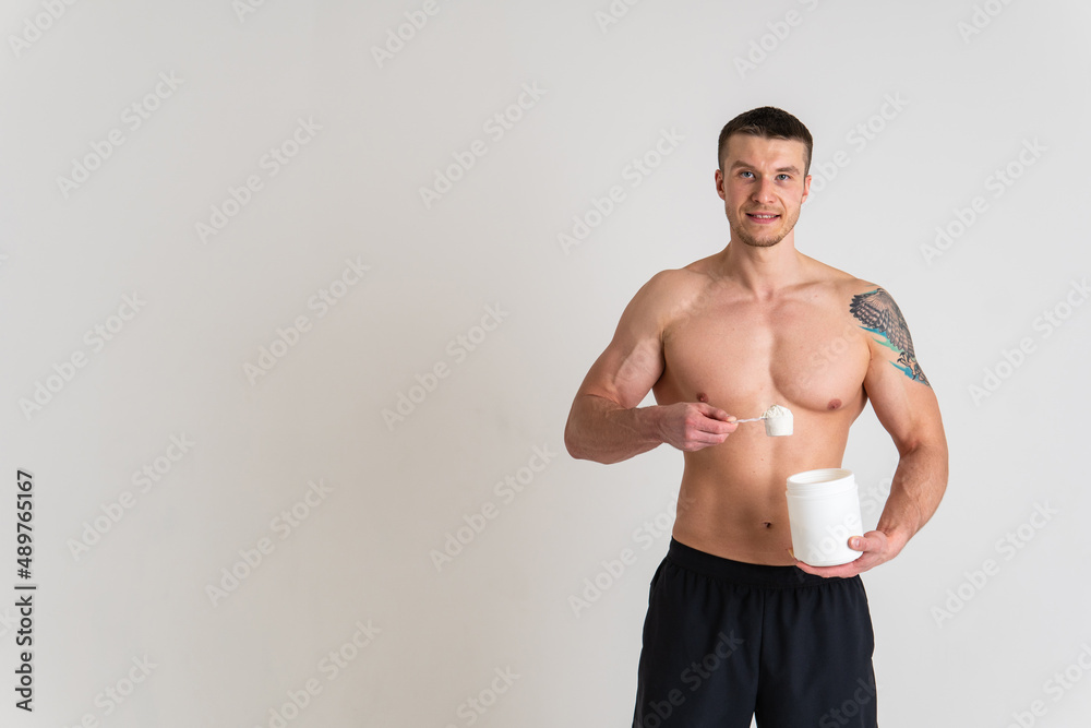 Fitness protein jars white on white background bodybuilder powder strong high back hurt painful, cramp sick man massage stress, holding. Tension red sickness, disease suffer attractive